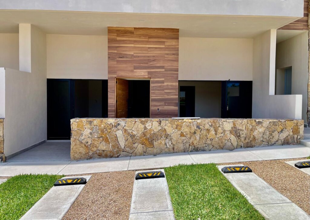 Los Cabos Brisas Del Tezal Ready for delivery! Brisas del Tezal ground-floor condo featuring 2 bedrooms and 2 bathrooms in an exclusive low-density community of 36 units across two 4-story elevator buildings. Located minutes from Medano Beach and downtown Cabo. Showcases excellent construction quality and craftsmanship from the developer, including parota wood carpentry and a large, solid front door. Features rare 3.7 meter-12.4 ft high ceilings, creating an exceptional sense of space and light, marble flooring throughout, spacious balcony, granite countertops and backsplash in the kitchen, pantry, bathrooms with marble showers to the ceiling, wall-to-wall closets, and a laundry room with space for side-by-side washer and dryer, plus manual washing area and storage. Equipped with 1-ton A/C mini-splits in each bedroom and two in the living area.Enjoy sunset – 3.7 m extra-high ceilings, Cabo Corridor, BS