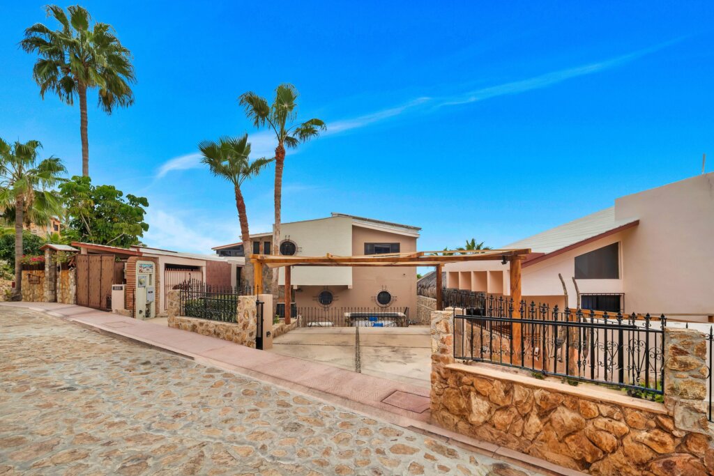 Los Cabos Finisterra SEE PRIVATE REMARKS TO TOUR !58 Paseo Finistera rests on Over 1/3 acre Corner lot.Finistera is San Jose's most sought after private neighborhood. Close to downtown.A spacious 4 bedroom, 5 full baths home. Including two Casitas one casita offers a second kitchen!A solid rock wall surrounds the property.This 4,000 square foot custom built resorthome offers 14 foot high soaring ceilings throughout.The entry offers a 15 foot high dome ceiling,for light. Mature cactus landscaping, plus graceful terraces surround the large pool and jacuzzi.The circular stone fire pit area surrounded with built in benches has spacious seating.Full bathroom with shower located outside in yard area.Large laundry room with storage for sale