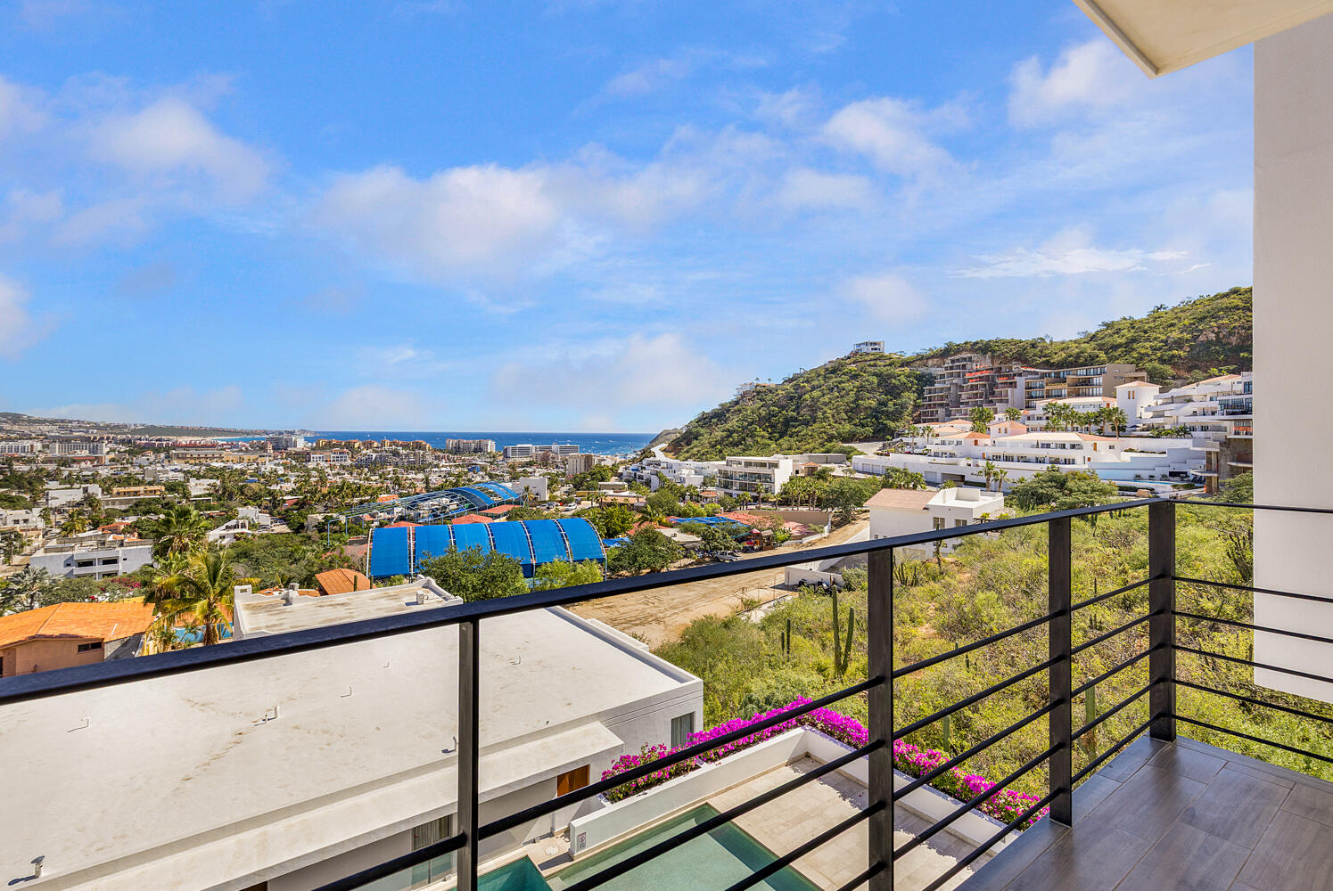 Los Cabos Lienzo Charro Condo 503 at Condominios Libertad 1065 offers 1,154 sq ft of modern living with unobstructed ocean and city for sale