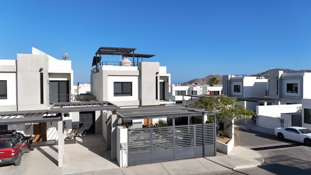 Los Cabos Cumbre Del Tezal Move-in ready and fully furnished. 2,045 sq ft of construction on a 2,551 sq ft lot with 3-car parking. Luxury finishes include marble flooring, wood kitchen with granite countertops, built-in wooden closets in all bedrooms, and vanities with tempered glass shower doors in all 3.5 baths. Fully equipped with 5 Gree inverter mini-split A/C units (3 × 1-ton, 2 × 2-ton), LG 22' French Door refrigerator, Whirlpool gas stove, and 1.7 cu ft microwave hood. Additional features: rooftop with bar, grill & sink, private terrace, storage, WiFi smart lock, private 5,000-liter cistern, and termite prevention system. ommunity: pool, gym, sports courts, kids' area, 3 clubhouses & 24/7 gated security for sale