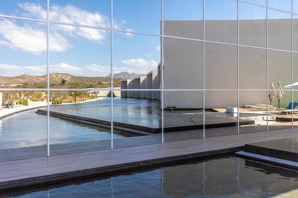 Los Cabos Dunna Welcome to Dunna - A New Standard of Luxury in Cabo. More than a residence, Dunna is a vibrant, fully integrated community where luxury, culture, and recreation converge. Designed by renowned architects Sordo Madaleno, this visionary development seamlessly blends timeless elegance with natural tranquility, offering meticulously crafted residences and garden villas complemented by world-class amenities. Elevated Living, Unmatched Experiences Choose from 13 thoughtfully designed floor plans from 2 - 5 bedrooms ranging from 1,475 - 6,458 sq. ft., featuring seamless indoor-outdoor living, elegant finishes, private rooftops, jacuzzis, and lush garden terraces. Resort-Style AmenitiesEnjoy unparalleled amenities, including:" Infinity pools (Adults-only, Family, Kids & Oasis)" State-of-the-art wellness & fitness center" Luxury spa (sauna, steam, ice baths, massage suites)" Exclusive rooftop lounges & panoramic – LADERA Carr. Transp. Km24.5 Cerro C, San Jose Corridor, BS