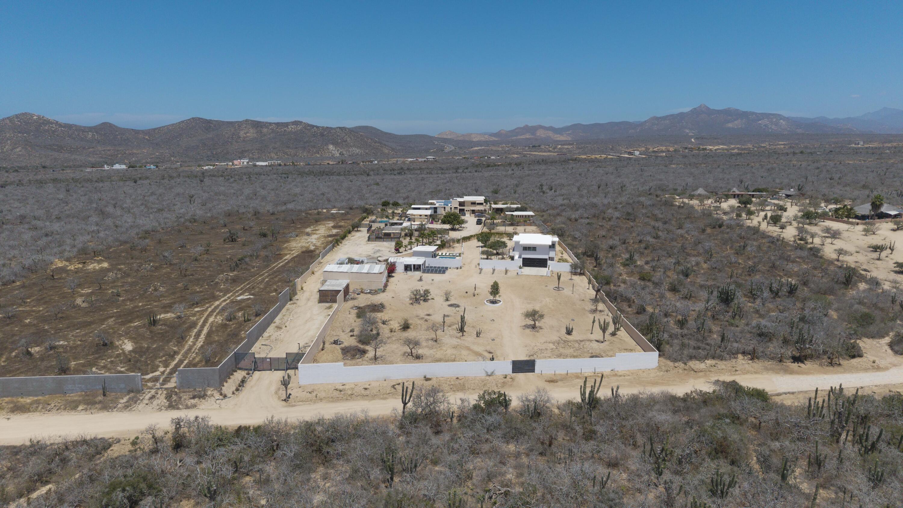 Los Cabos El Tule-Inland:General Rare investor opportunity in the San José Corridor. 2 luxury residences fully completed and move-in ready. 8 additional units with land secured and full blueprints in place -- ready to build to buyer's vision. At – 2-C Cerro del Vigia, Cabo San Lucas, BS