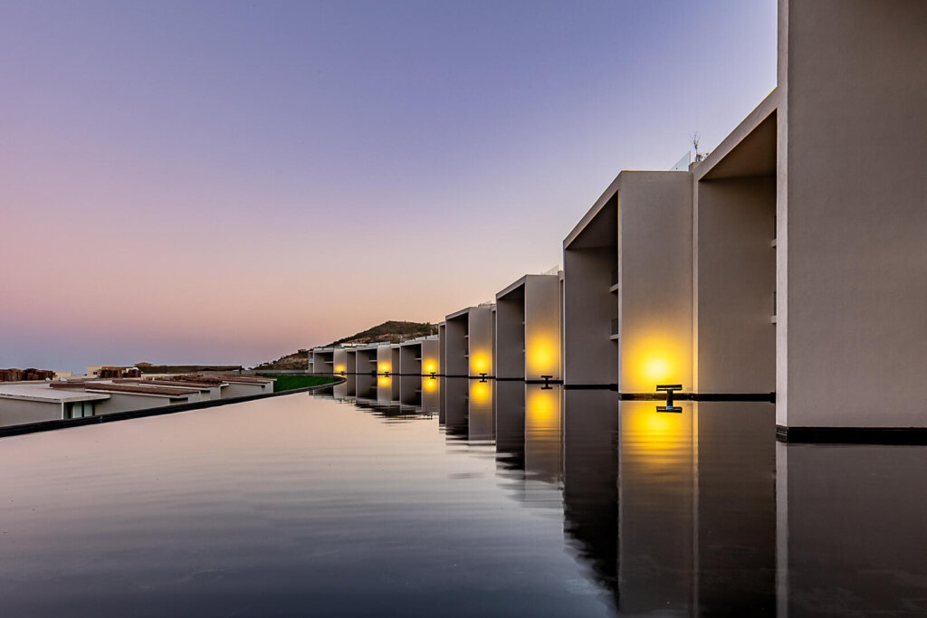 Los Cabos Cora SUNSET A 101- the crown jewel of the entire development. A rare 6-bedroom, 5.2-bath residence spanning two full living levels: the main floor plus a private underground bunker suite with its own living room, dining room, kitchen, bedrooms and baths -- ideal for multigenerational living or an income-producing guest retreat. Enjoy a private pool, jacuzzi, fire pit and BBQ area under an extended pergola, plus an extended terrace beside a tranquil espejo de agua. Ocean – SUNSET PASEO DEL MONTE CLUB CAMPESTRE, San Jose del Cabo, BS